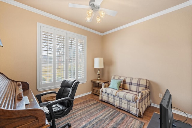 home office featuring crown molding, plenty of natural light, and hardwood / wood-style flooring