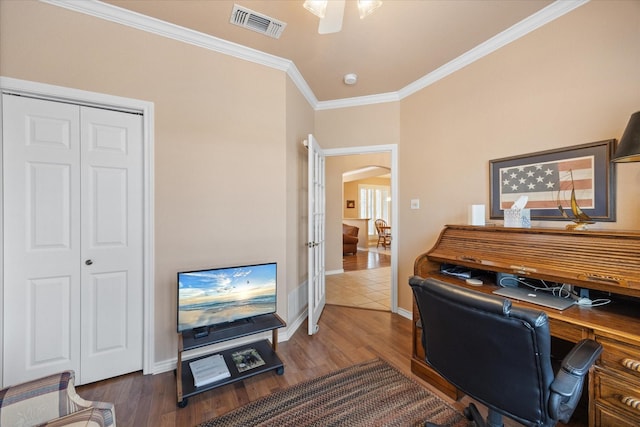 home office featuring ornamental molding, ceiling fan, and dark hardwood / wood-style flooring