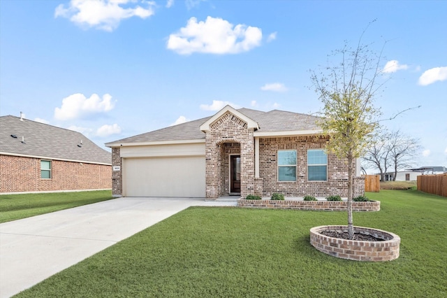 view of front of house featuring a garage and a front yard