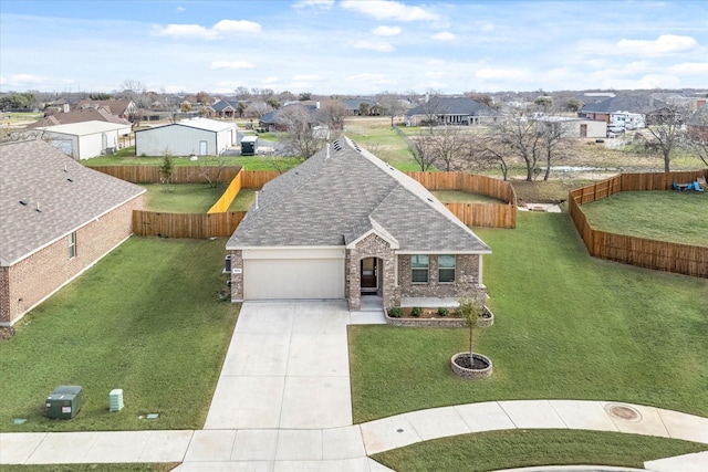 view of front of property with a garage and a front yard