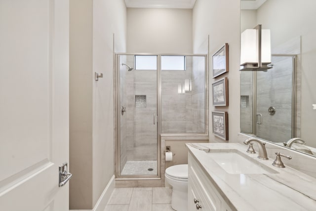 full bathroom with a shower stall, toilet, and vanity