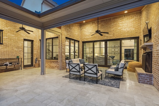 view of patio featuring ceiling fan and an outdoor living space