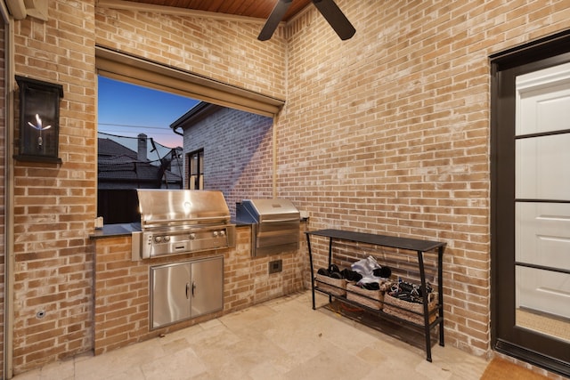 view of patio with ceiling fan, grilling area, and area for grilling