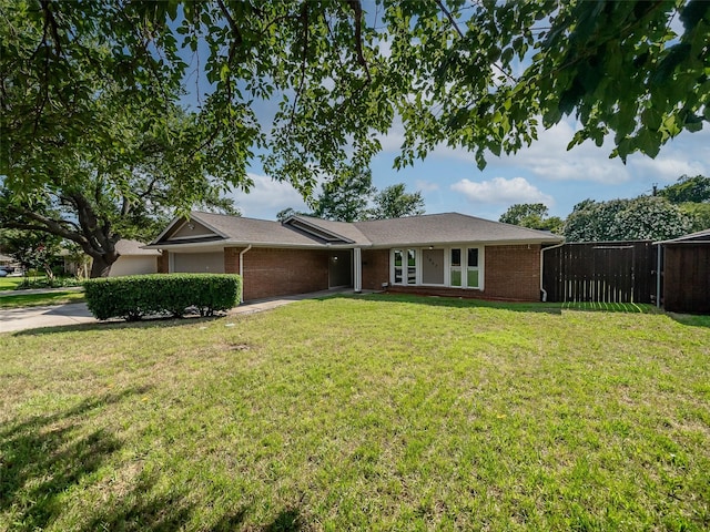 single story home with a front yard