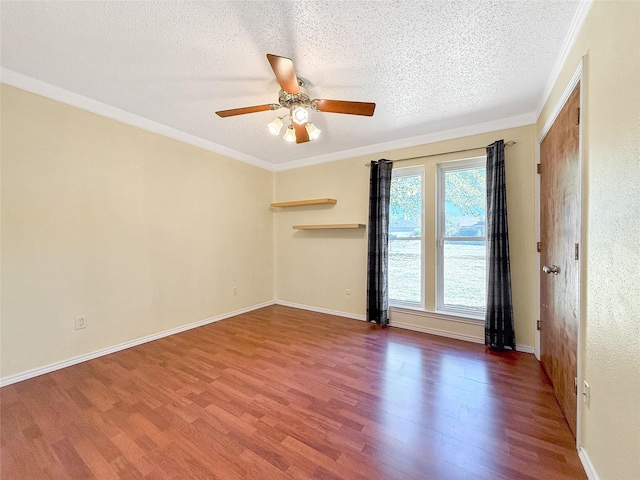 unfurnished room featuring wood-type flooring, ceiling fan, a textured ceiling, and crown molding