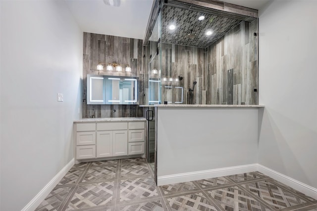 bathroom featuring tasteful backsplash, parquet flooring, and vanity