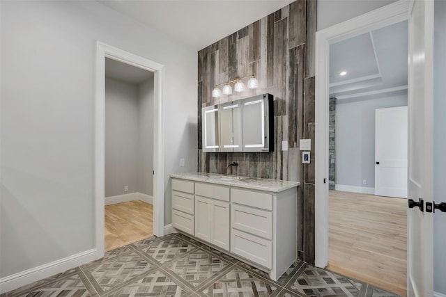 bathroom featuring vanity, wood-type flooring, and backsplash