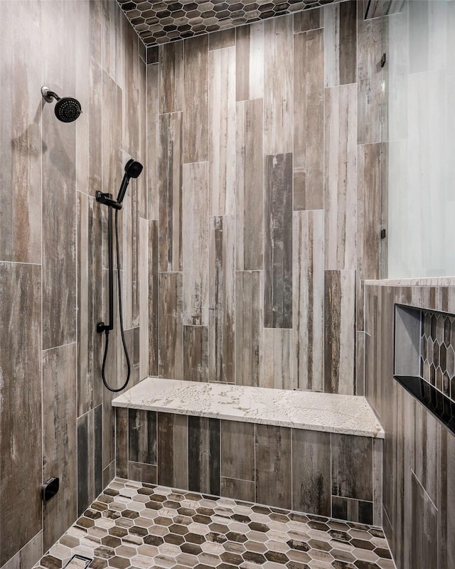 bathroom with tiled shower