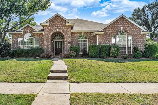 front facade with a front yard