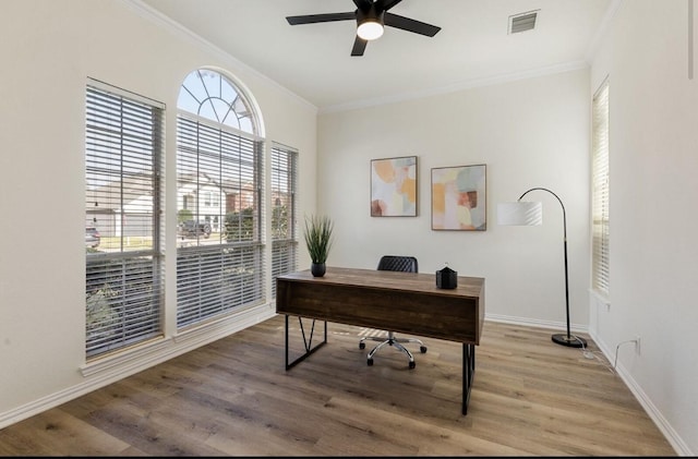 office with hardwood / wood-style flooring, ceiling fan, and crown molding