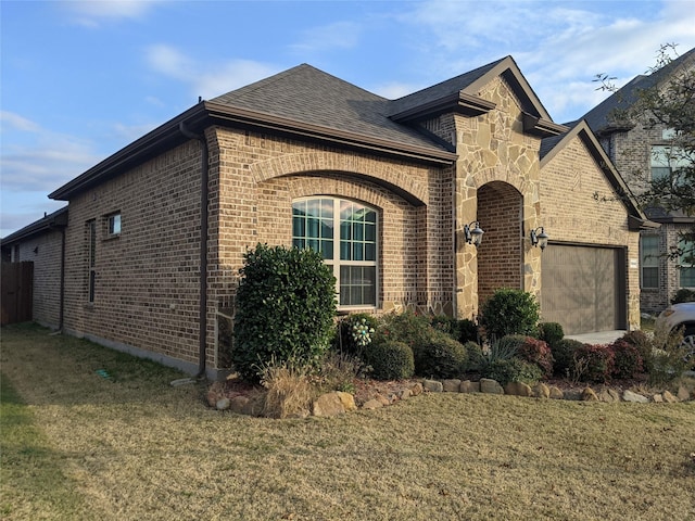 view of home's exterior featuring a yard and a garage