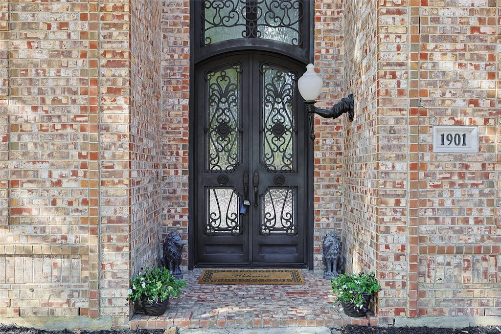 entrance to property featuring french doors