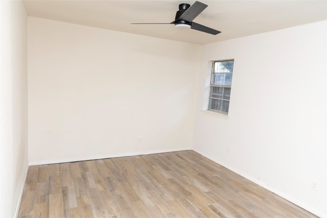 spare room featuring ceiling fan and light hardwood / wood-style floors