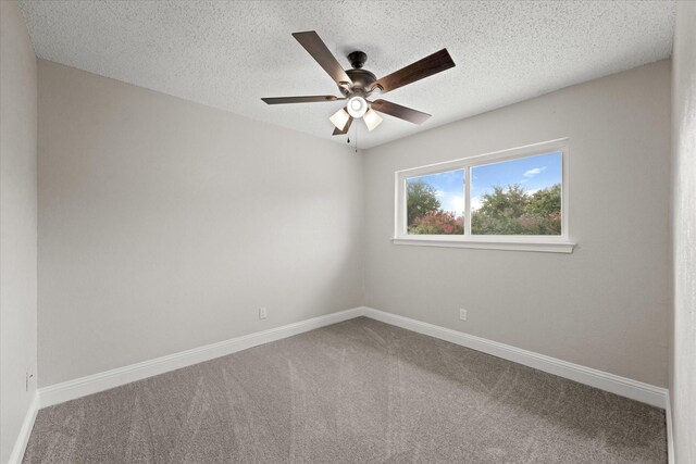 unfurnished room featuring carpet, a textured ceiling, and ceiling fan