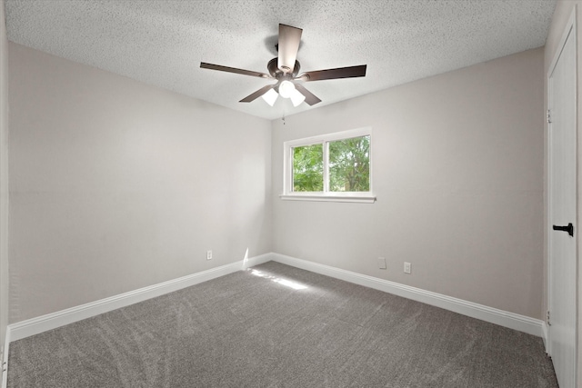 spare room with carpet, ceiling fan, and a textured ceiling