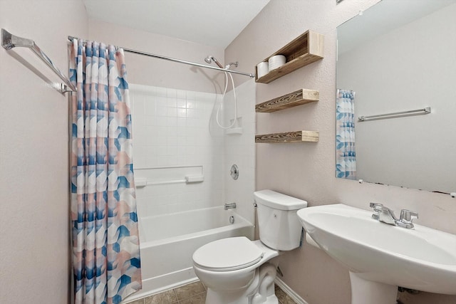 full bathroom with sink, shower / tub combo, and toilet