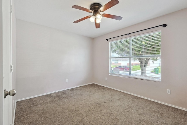 carpeted empty room with ceiling fan