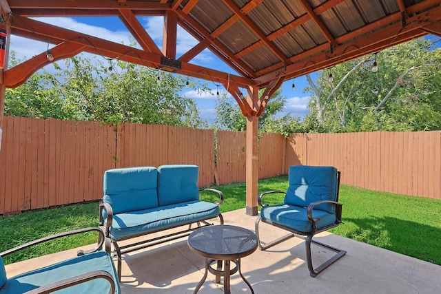 view of patio with an outdoor living space and a gazebo