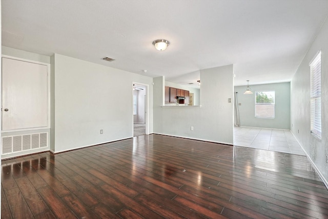 unfurnished room featuring wood-type flooring