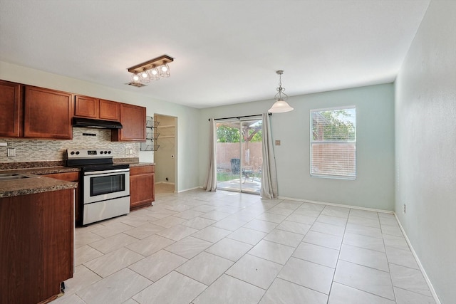 kitchen with sink, decorative light fixtures, light tile patterned floors, electric range, and backsplash