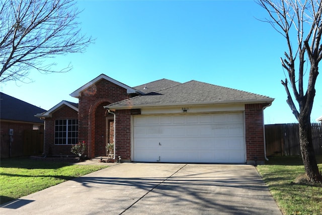 view of front facade featuring a garage and a front lawn