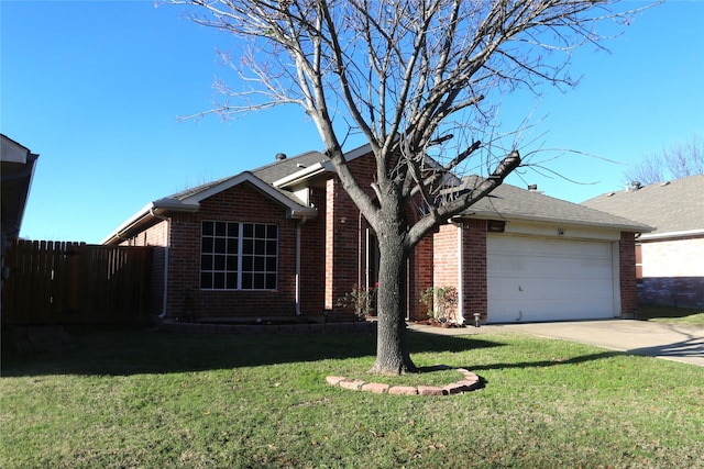 ranch-style home with a garage and a front lawn