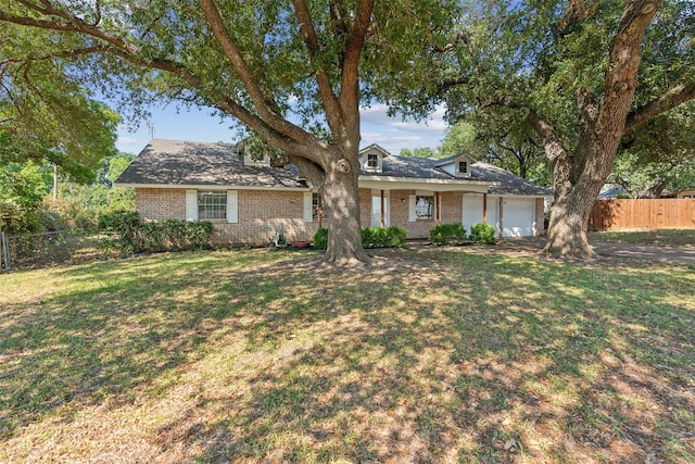 single story home with a garage and a front lawn