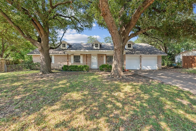 ranch-style home with a front yard and a garage