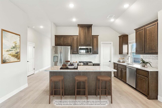 unfurnished living room featuring a fireplace, ceiling fan, light hardwood / wood-style floors, and plenty of natural light