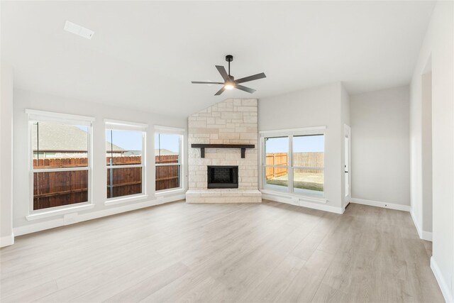 empty room featuring ceiling fan, vaulted ceiling, and carpet flooring