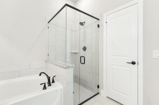 bathroom featuring tile patterned floors and plus walk in shower