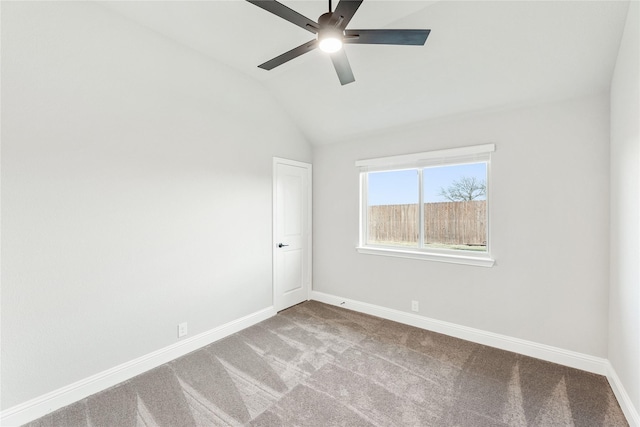 unfurnished room with ceiling fan, vaulted ceiling, and carpet floors