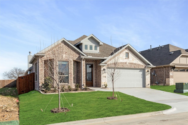 craftsman-style house featuring a front yard and a garage