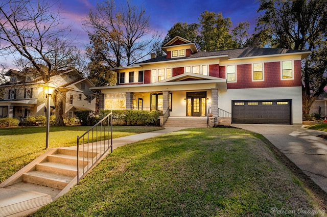 view of front of house with a porch, a front yard, driveway, and an attached garage