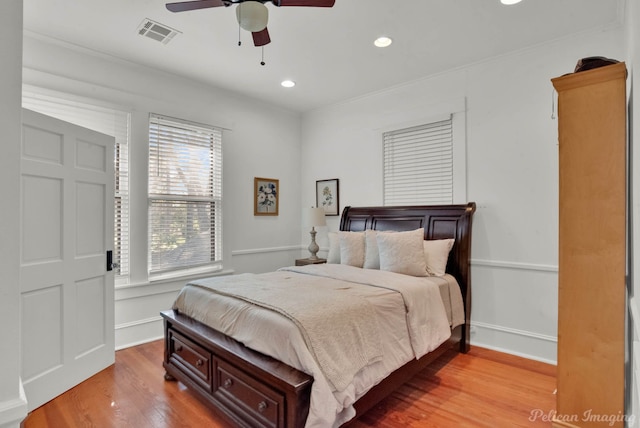 bedroom with recessed lighting, visible vents, ceiling fan, wood finished floors, and baseboards