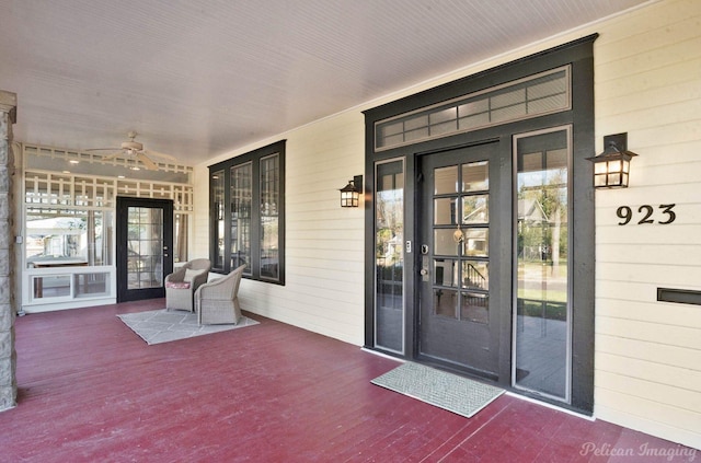 property entrance with a porch and ceiling fan