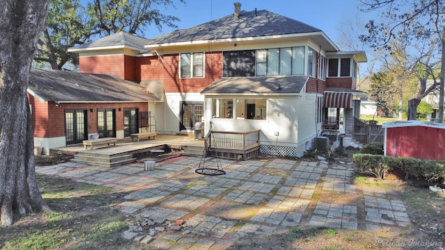 rear view of house with a patio area and a deck