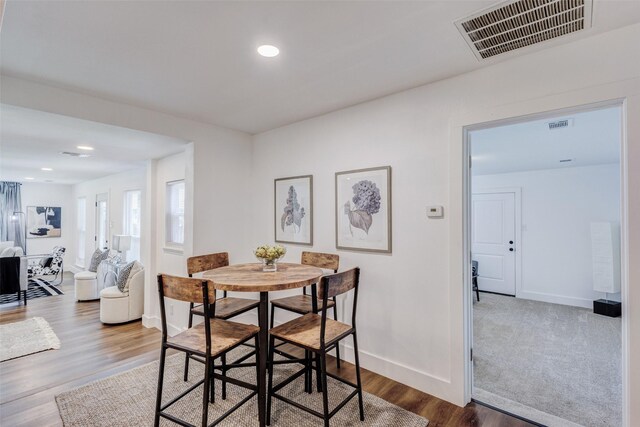 dining area with wood-type flooring