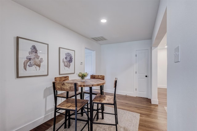 dining room with hardwood / wood-style floors