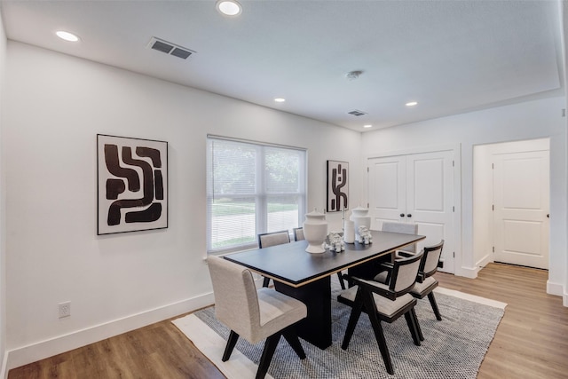 dining space featuring light wood-type flooring