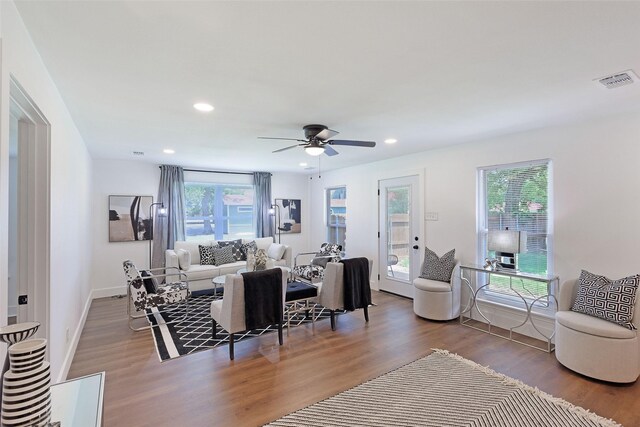 living room with ceiling fan and hardwood / wood-style floors