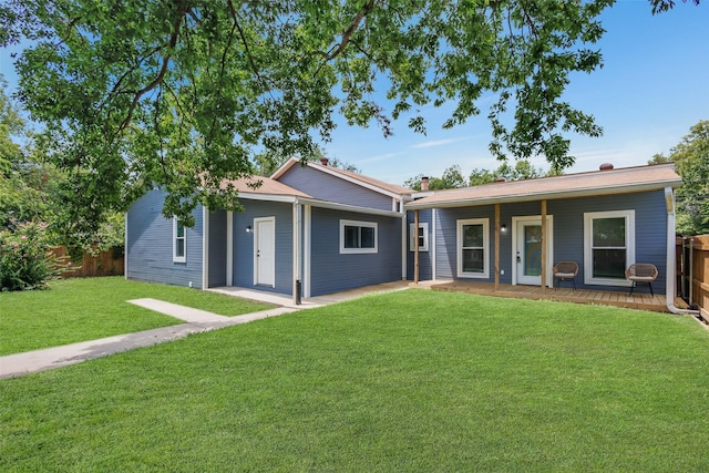 ranch-style house with a front yard and a porch