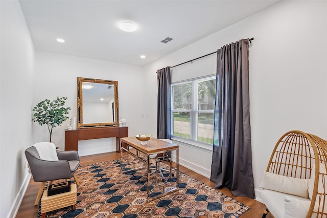 living area with wood-type flooring