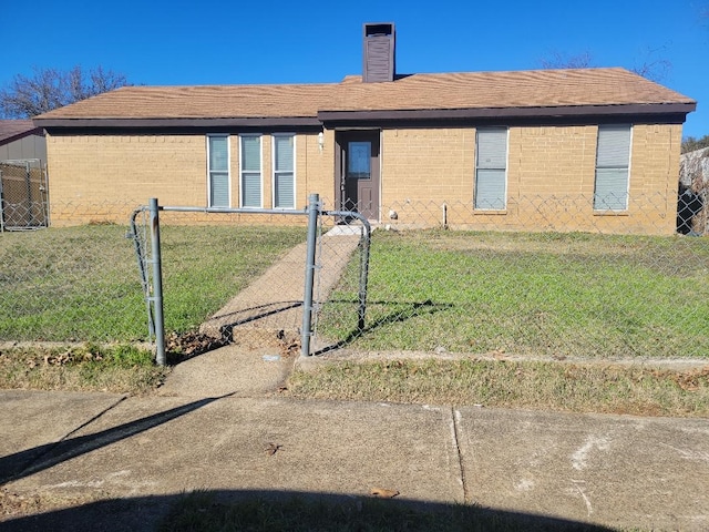 rear view of property with a yard