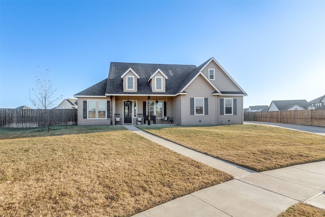 view of front of house featuring a front yard and a porch