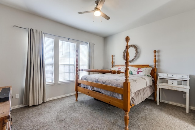 carpeted bedroom featuring ceiling fan and multiple windows