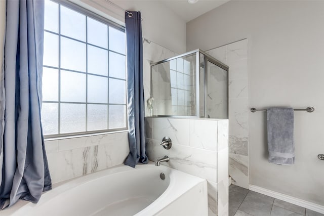 bathroom with tile patterned floors and plus walk in shower