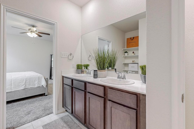 bathroom featuring ceiling fan, vanity, and tile patterned flooring