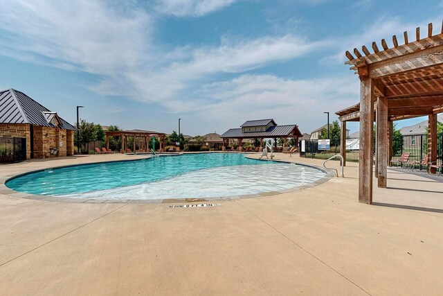 view of pool with a pergola and a patio area