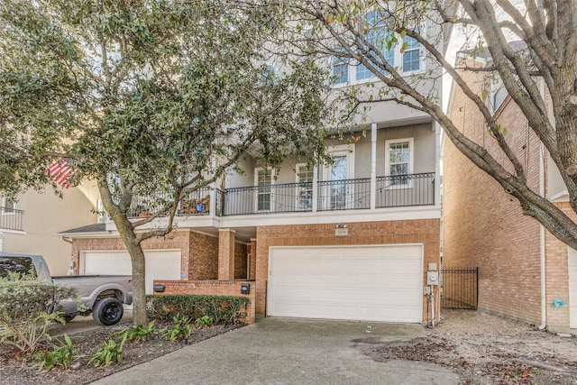 view of front of home with a garage and a balcony